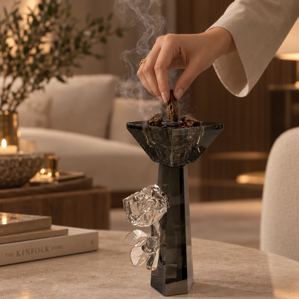 Smoky dark incense burner with rose decoration shown in a styled home setting